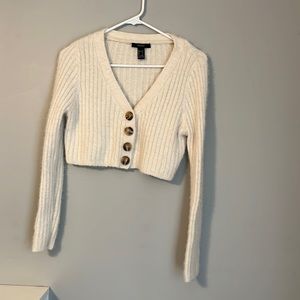 Cropped knit sweater.